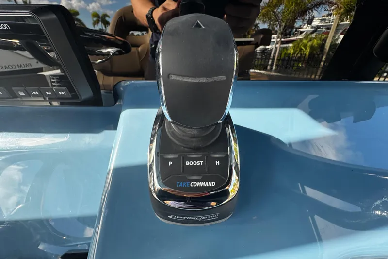 Slide: The Image of 2026 Sea Pro 292 DLX boat control panel with joystick and digital display. - 24