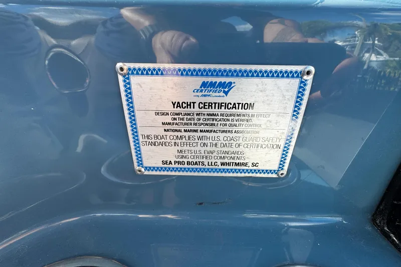 Slide: The Image of 2026 Sea Pro 292 DLX yacht certification plaque, NMMA certified, Coast Guard safety standards compliance. - 26