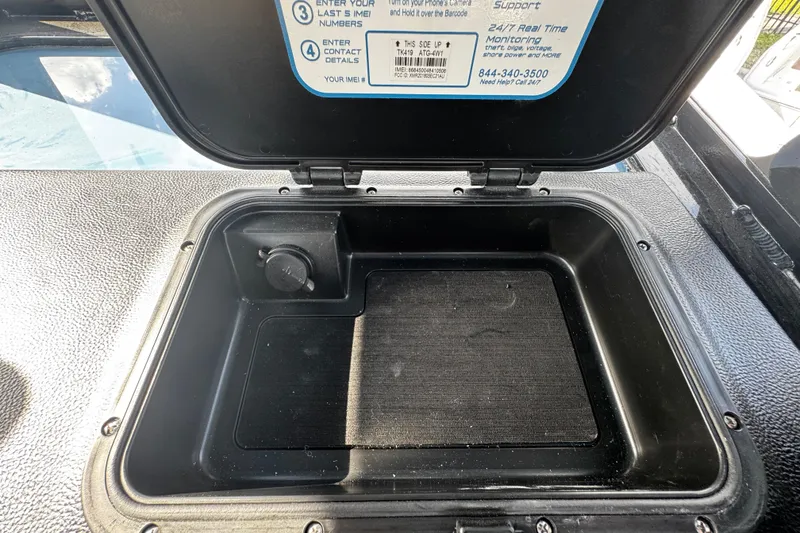 Slide: The Image of Open storage compartment on 2026 Sea Pro 292 DLX boat, featuring a secure lid. - 29