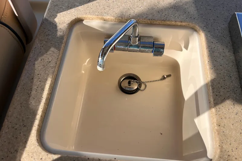 Slide: The Image of Sink with chrome faucet on 2009 Mainship Pilot 31 boat. - 24