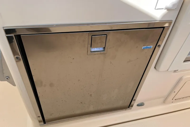 Slide: The Image of Stainless steel door on 2009 Mainship Pilot 31 boat, featuring U-Line logo. - 26