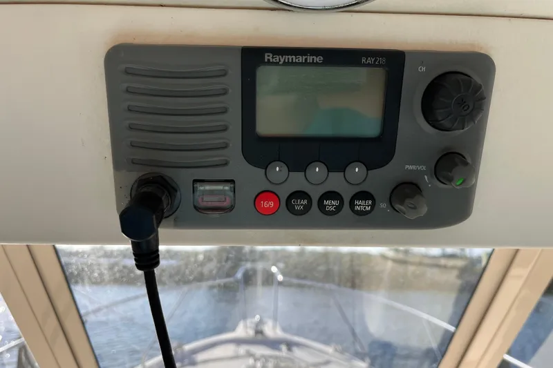 Slide: The Image of Raymarine RAY218 marine radio on 2009 Mainship Pilot 31 boat dashboard. - 30