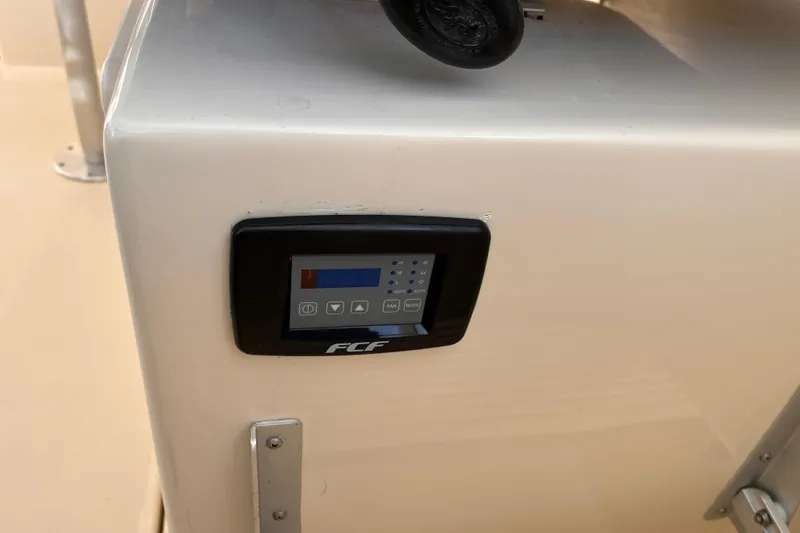 Slide: The Image of Control panel on 2009 Mainship Pilot 31 boat, featuring FCF display. - 34