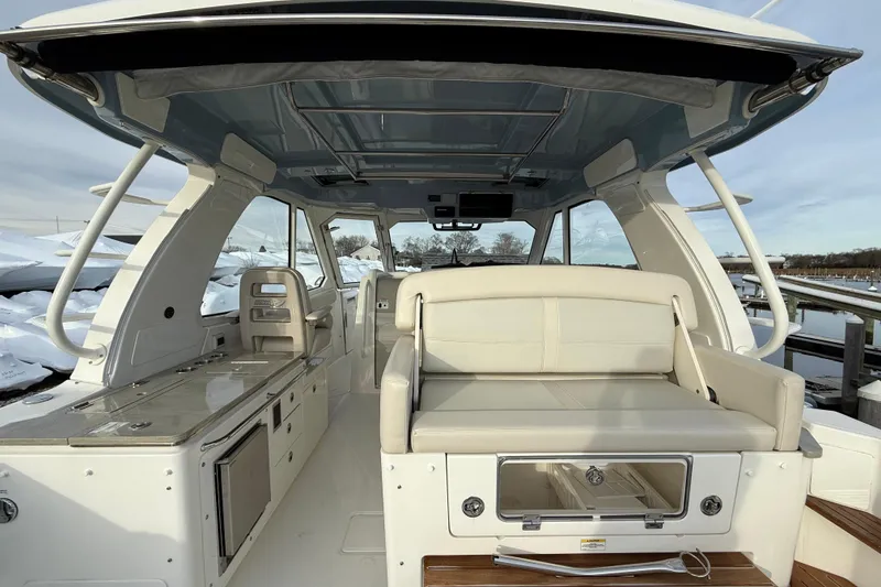 Slide: The Image of 2021 Boston Whaler 380 Realm interior with seating and storage, showcasing luxury and functionality. - 14
