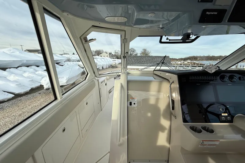 Slide: The Image of Interior view of 2021 Boston Whaler 380 Realm boat cockpit with navigation equipment. - 18
