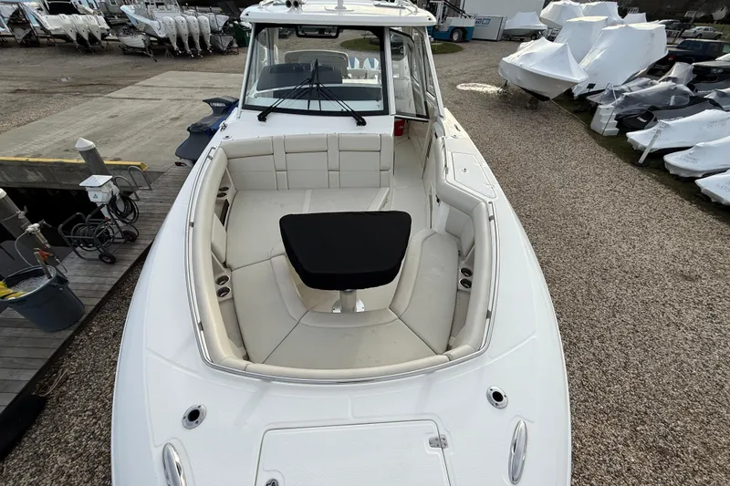 Slide: The Image of 2021 Boston Whaler 380 Realm boat with spacious seating and sleek design. - 21