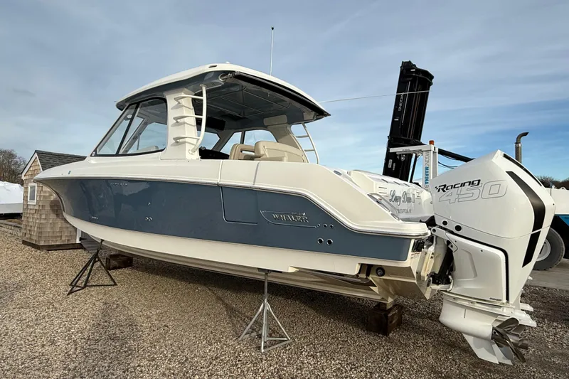 Slide: The Image of 2021 Boston Whaler 380 Realm boat with Racing 450 engine on display. - 3