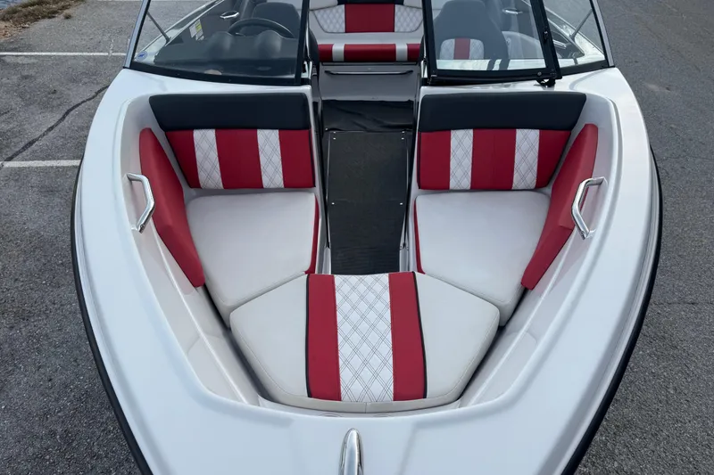 Slide: The Image of 2015 Glastron GTS 187 boat interior with red and white seating. - 15