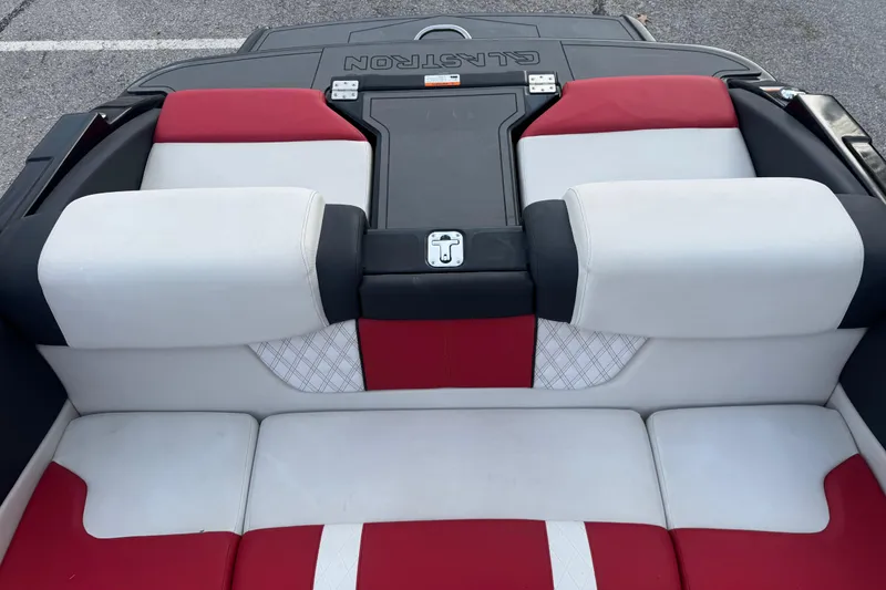 Slide: The Image of 2015 Glastron GTS 187 boat interior with red and white seating. - 17