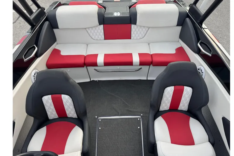 Slide: The Image of 2015 Glastron GTS 187 boat interior with red and white seating, modern design. - 18