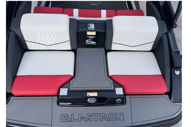 Slide: The Image of 2015 Glastron GTS 187 boat interior with red and white seating. - 24