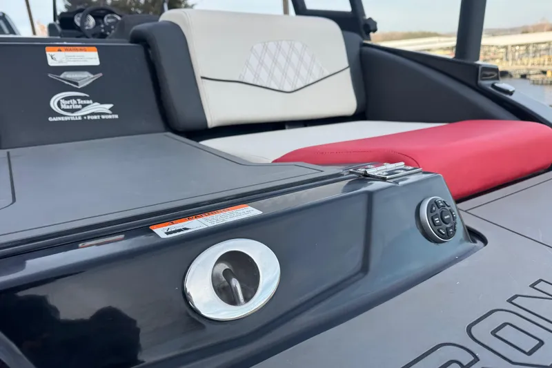 Slide: The Image of 2015 Glastron GTS 187 boat interior with seating and control panel. - 25