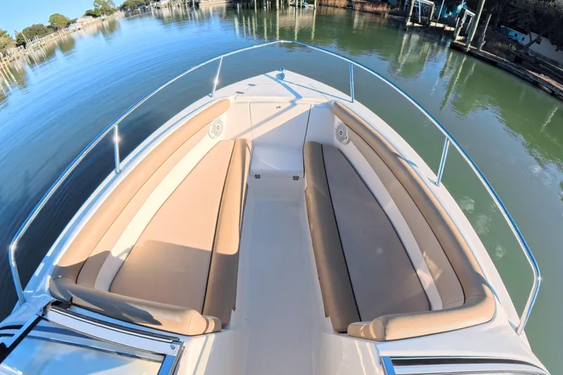 Slide: The Image of 2017 Scout 210 Dorado boat with spacious bow seating on calm water. - 15