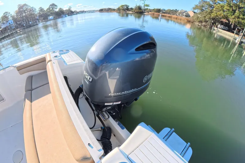 Slide: The Image of 2017 Scout 210 Dorado boat with Yamaha outboard motor on a calm river. - 22