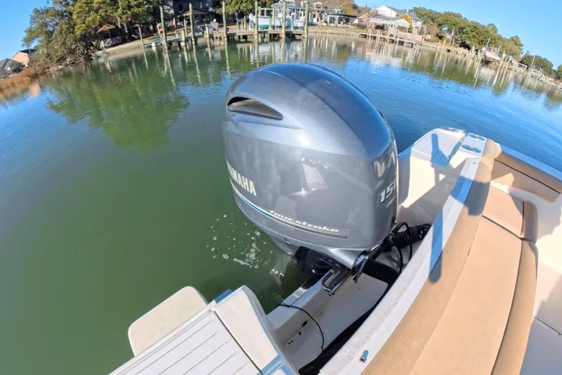 Slide: The Image of 2017 Scout 210 Dorado boat with Yamaha outboard motor on calm water. - 24