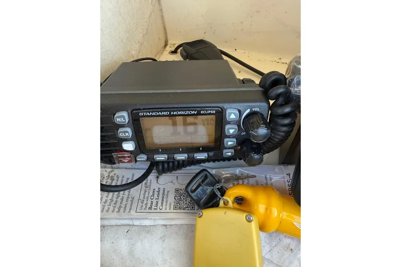 Slide: The Image of Standard Horizon Eclipse radio on 2017 Scout 210 Dorado boat, with yellow safety equipment. - 28