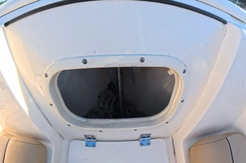 Slide: The Image of 2017 Scout 210 Dorado boat storage compartment with open hatch. - 31