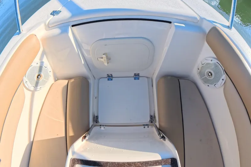 Slide: The Image of 2017 Scout 210 Dorado boat interior with seating and storage compartment. - 33
