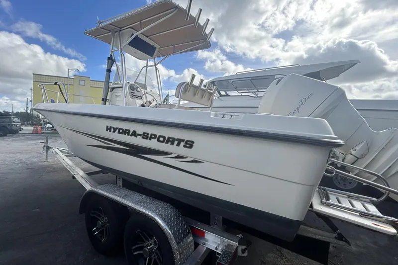 Slide: The Image of 2005 Hydra-Sports 212 CC boat on trailer under cloudy sky. - 14