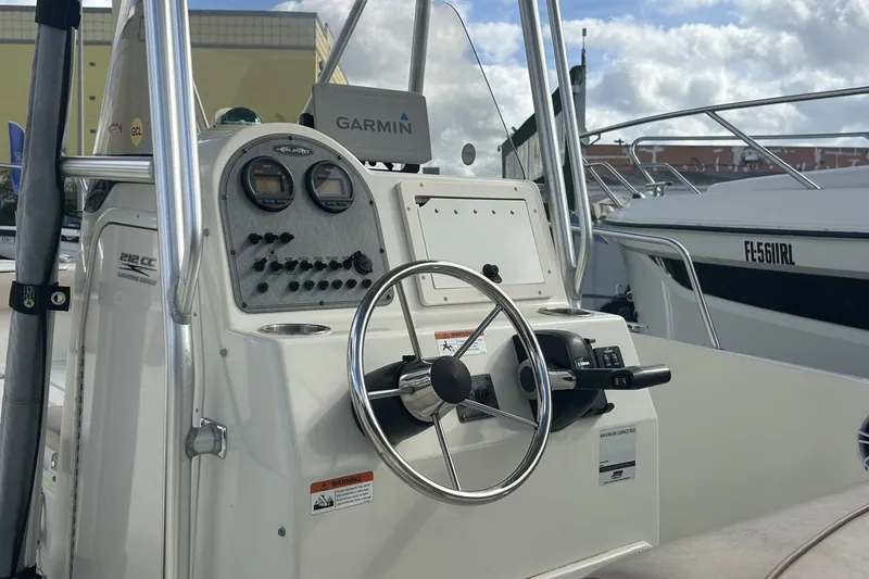 Slide: The Image of 2005 Hydra-Sports 212 CC boat console with Garmin navigation system and steering wheel. - 17