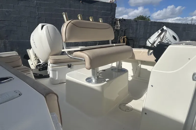 Slide: The Image of 2005 Hydra-Sports 212 CC boat interior with seating and outboard motor. - 8