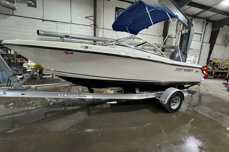 Slide: The Image of 2015 Key West 186 Dual Console boat on trailer in indoor storage facility. - 5
