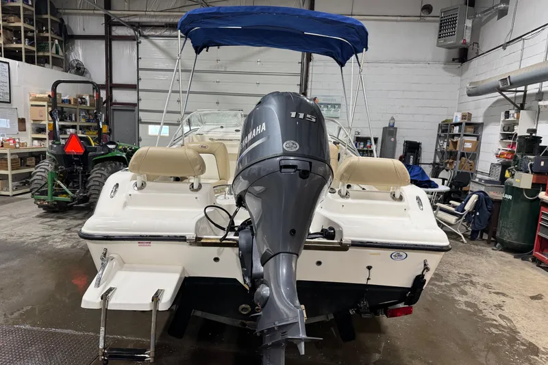 Slide: The Image of 2015 Key West 186 Dual Console boat with Yamaha 115 engine in a garage. - 6