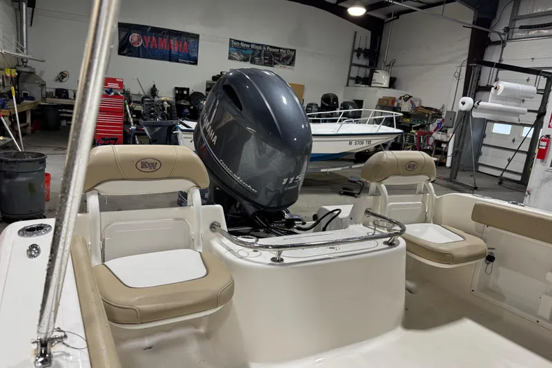 Slide: The Image of 2015 Key West 186 Dual Console boat with Yamaha engine in a workshop setting. - 9