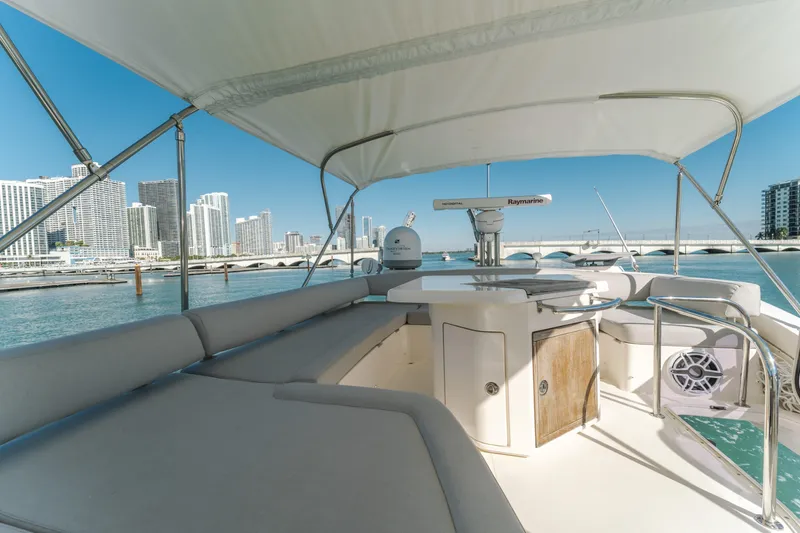 Slide: The Image of 2012 Azimut 48 Flybridge yacht with city skyline and bridge in the background. - 11