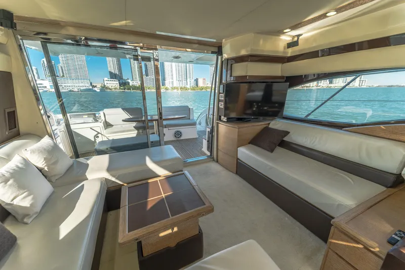 Slide: The Image of Luxurious interior of 2012 Azimut 48 Flybridge yacht with city skyline view. - 12