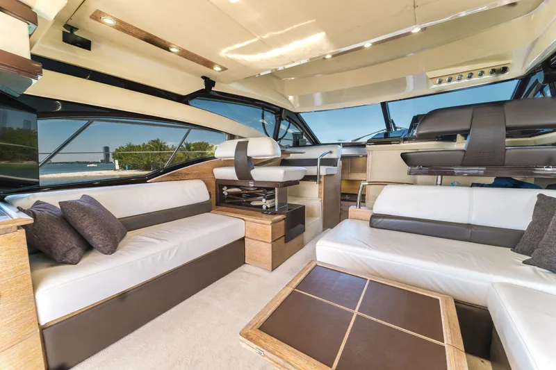 Slide: The Image of Luxurious interior of 2012 Azimut 48 Flybridge yacht with modern seating and panoramic windows. - 13