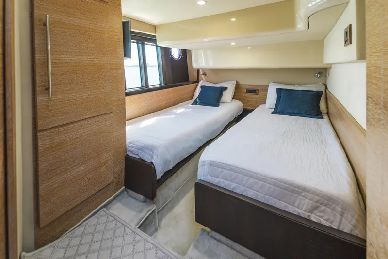 Slide: The Image of Luxurious twin bedroom in 2012 Azimut 48 Flybridge yacht with modern wood finishes. - 16