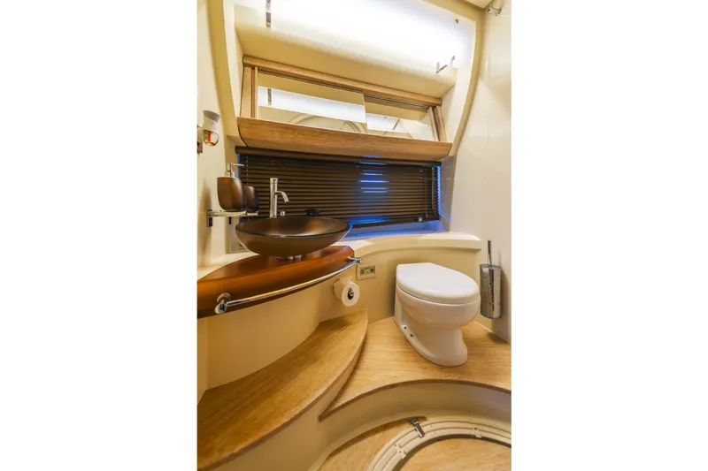 Slide: The Image of Luxurious bathroom in 2012 Azimut 48 Flybridge yacht with modern fixtures and wooden accents. - 17