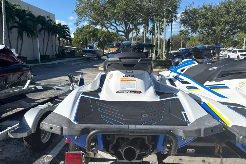 Slide: The Image of 2019 Yamaha WaveRunner VXR jet ski on a trailer, parked outdoors. - 4