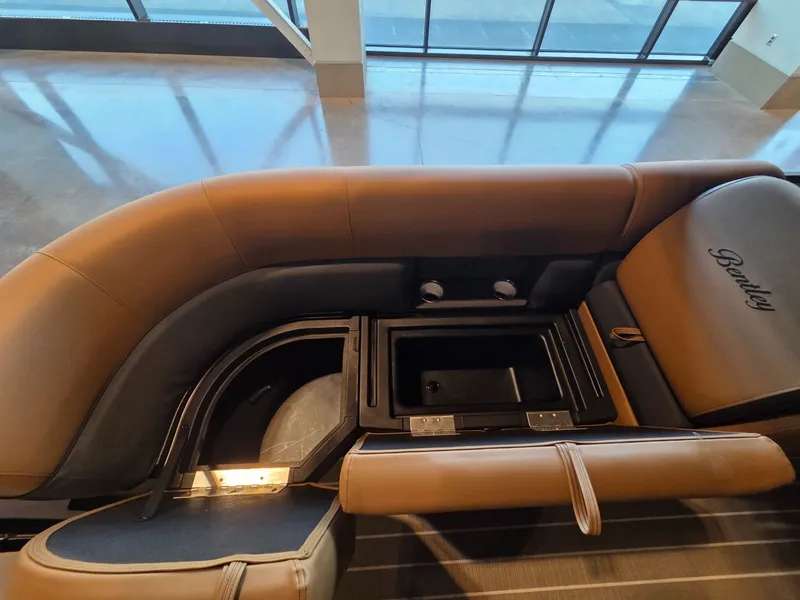 Slide: The Image of Interior of 2026 Bentley Pontoons Legacy 243 Navigator with storage compartment. - 25