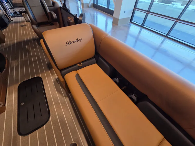 Slide: The Image of Luxurious interior of the 2026 Bentley Pontoons Legacy 243 Navigator. - 9