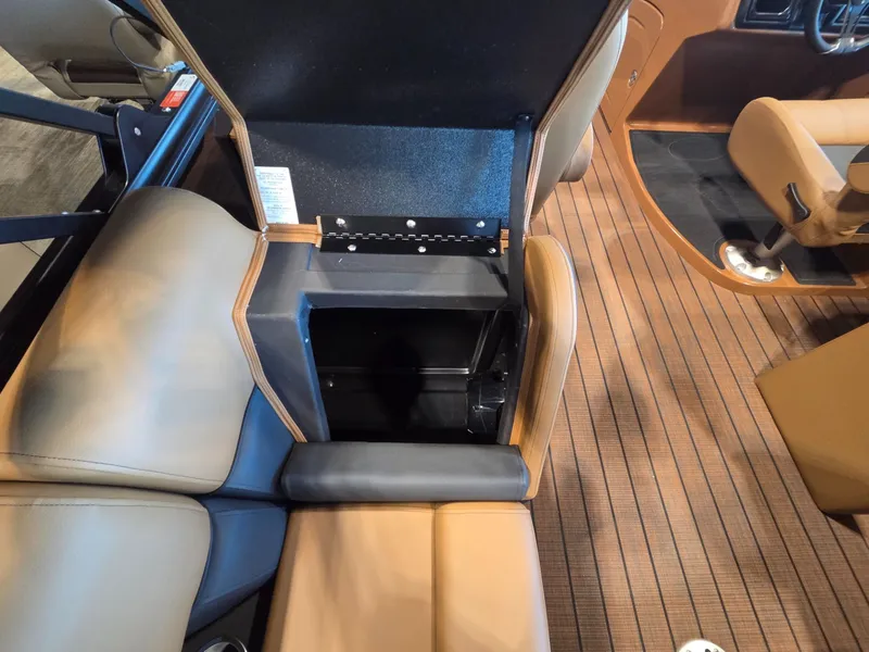 Slide: The Image of Interior of 2026 Bentley Pontoons Elite 253 Admiral with open seat compartment. - 25