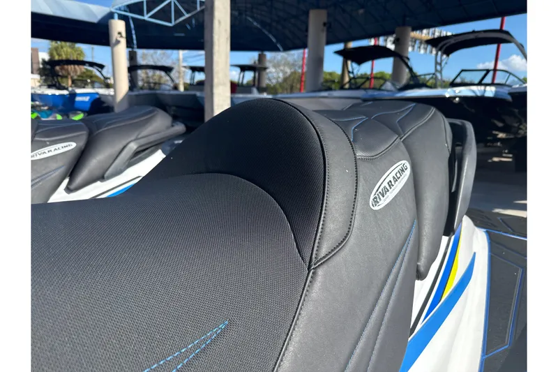 Slide: The Image of 2019 Yamaha WaveRunner VXR with Riva Racing seat, parked under a canopy. - 10