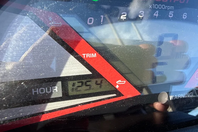 Slide: The Image of Close-up of 2019 Yamaha WaveRunner VXR dashboard showing 125.4 hours and trim indicator. - 11