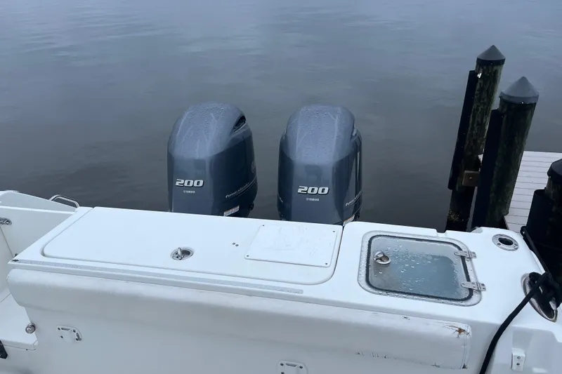 Slide: The Image of 2015 Sea Hunt Gamefish 27 with twin Yamaha 200 engines at dock. - 5