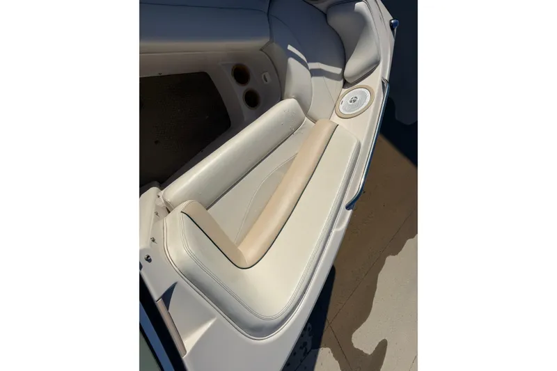 Slide: The Image of 1999 MasterCraft MariStar 210 VRS boat interior with beige seating and speaker. - 17