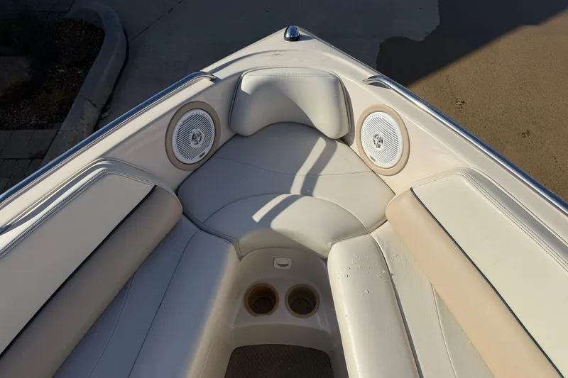 Slide: The Image of 1999 MasterCraft MariStar 210 VRS boat interior with beige seating and built-in speakers. - 18