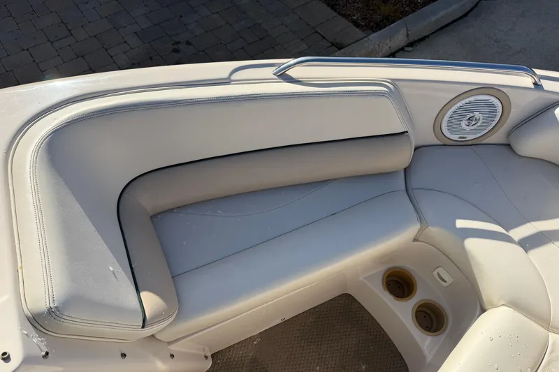 Slide: The Image of 1999 MasterCraft MariStar 210 VRS boat interior with beige seating and built-in speaker. - 19