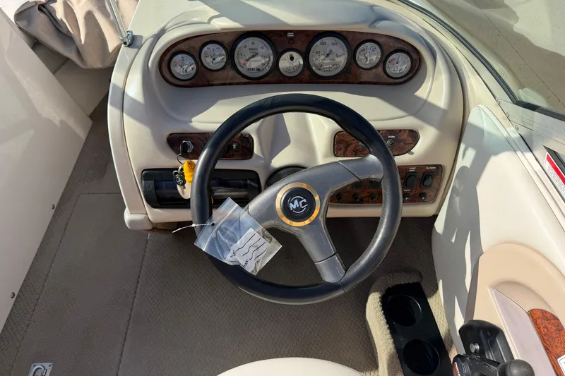 Slide: The Image of 1999 MasterCraft MariStar 210 VRS boat dashboard with steering wheel and gauges. - 4
