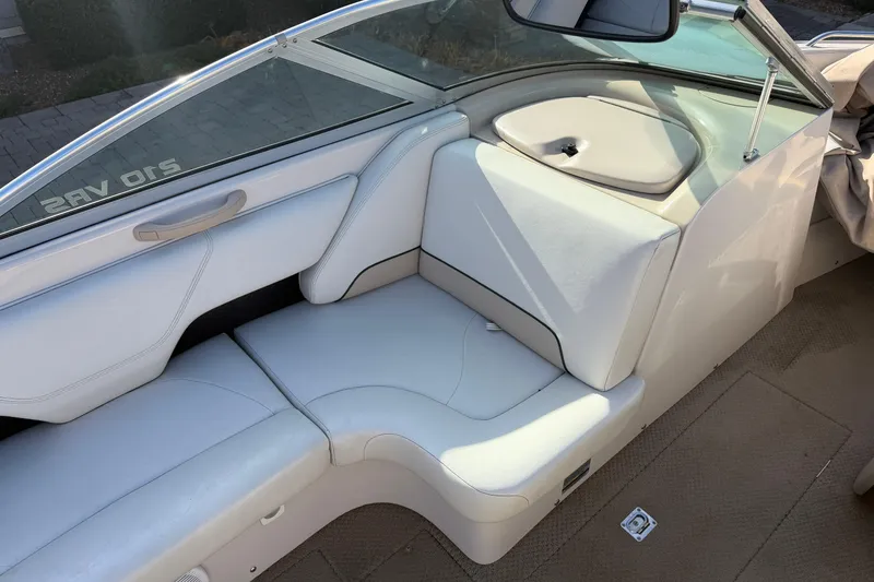 Slide: The Image of 1999 MasterCraft MariStar 210 VRS boat interior with white seating and sleek design. - 6