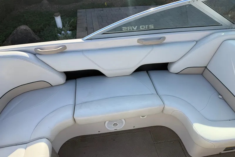 Slide: The Image of 1999 MasterCraft MariStar 210 VRS boat interior with white seating and sleek design. - 7