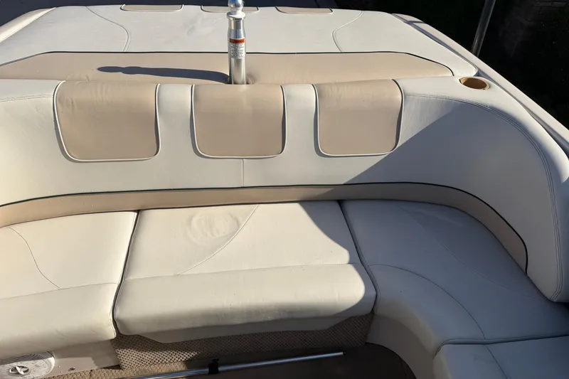 Slide: The Image of 1999 MasterCraft MariStar 210 VRS boat interior with beige and white seating. - 9