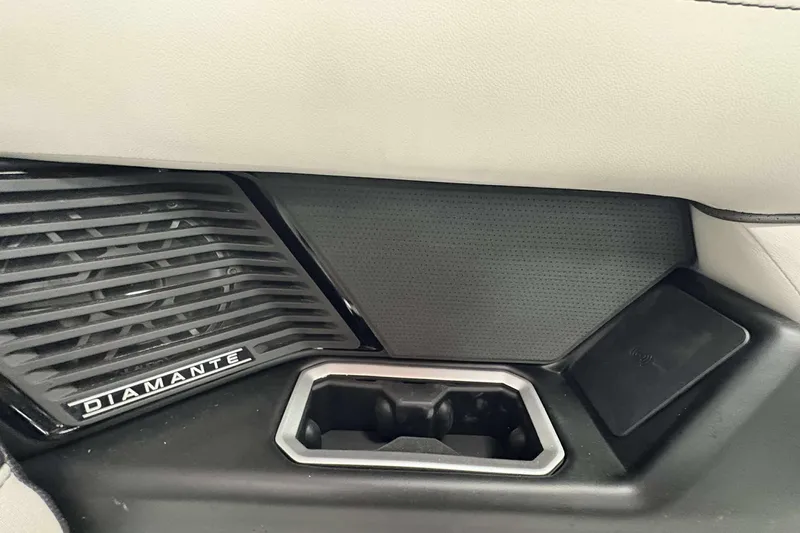 Slide: The Image of Interior detail of 2026 Viaggio D24U, featuring Diamante speaker grille and sleek design elements. - 10