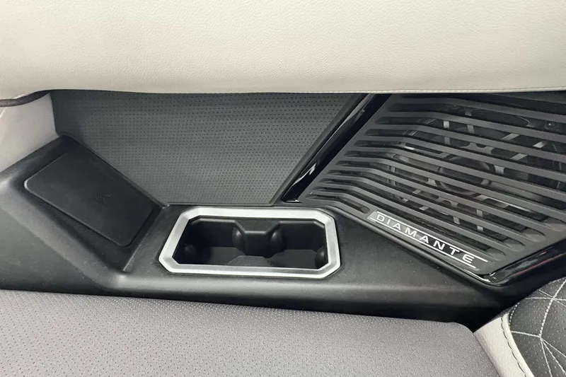 Slide: The Image of Interior of 2026 Viaggio D24U featuring sleek cup holder and Diamante speaker grille. - 12