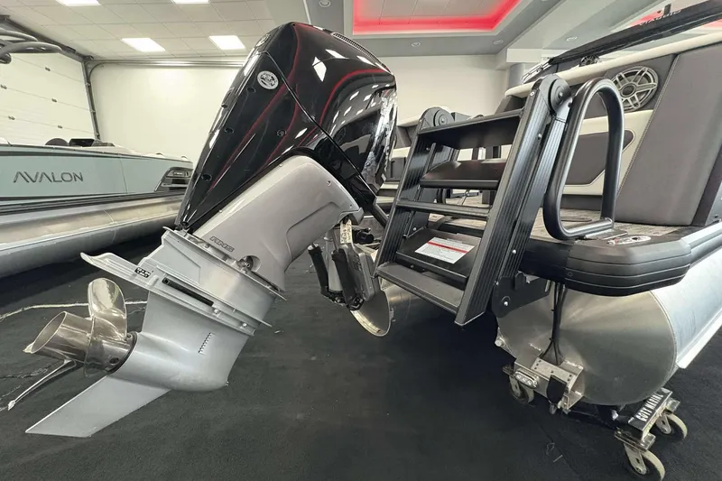 Slide: The Image of 2026 Viaggio D24U boat with powerful outboard motor and sleek design in showroom. - 15